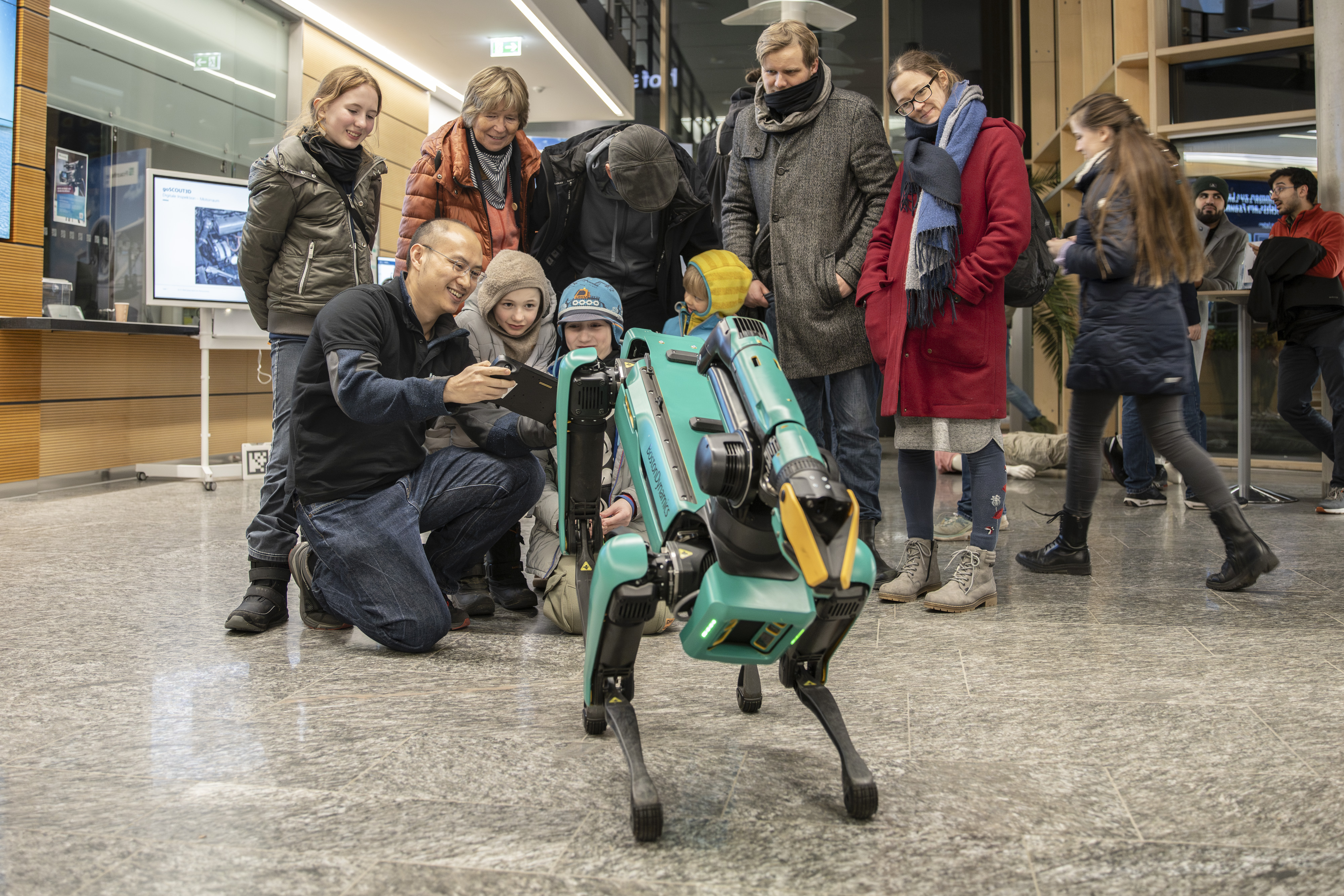 People with robot dog