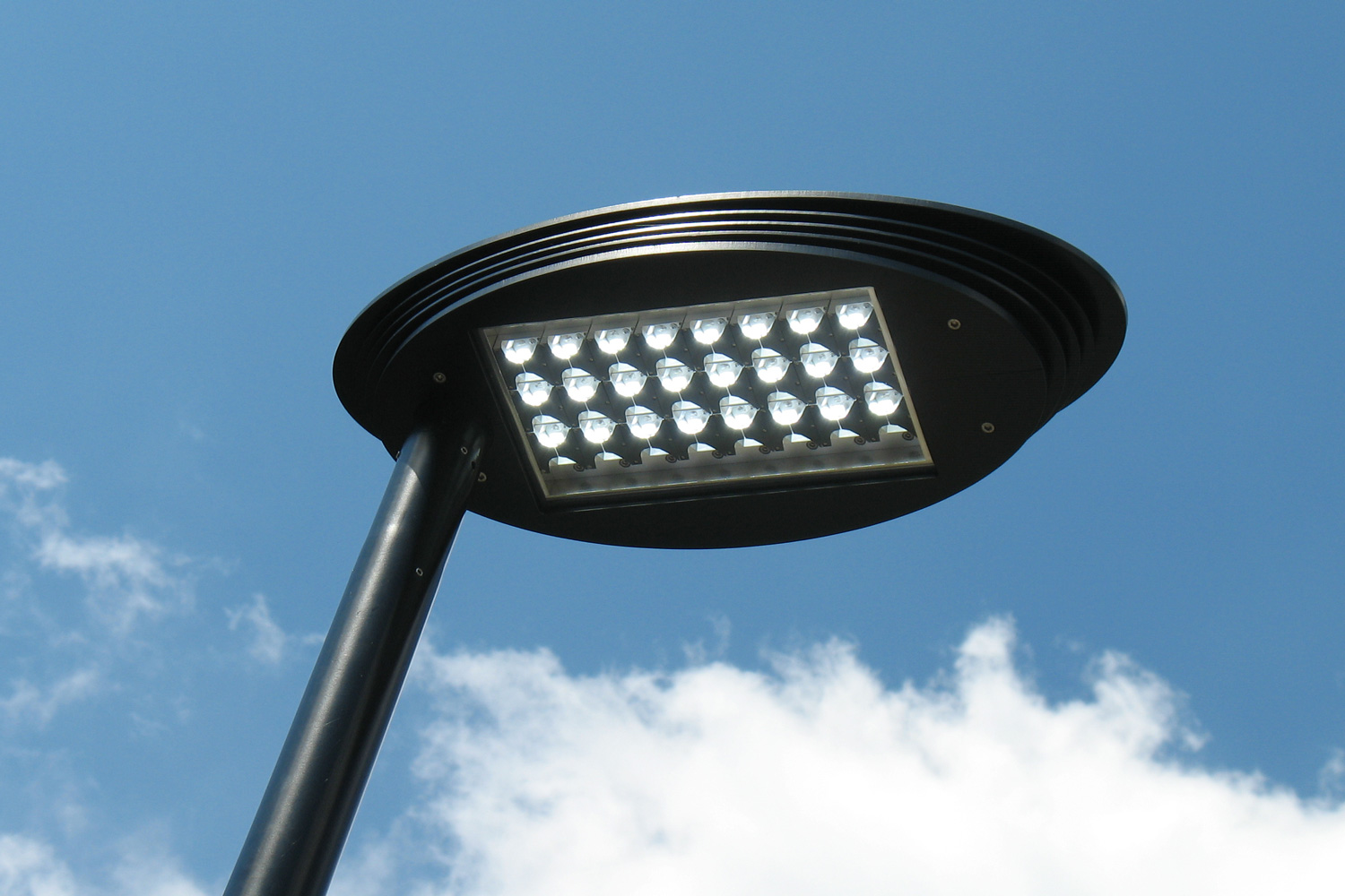 Head of a street light occupied by individual LED reflectors.