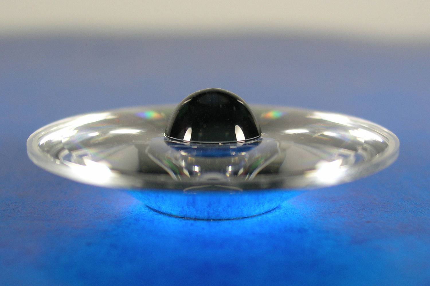Diamond-turned concentrator reminiscent of the shape of Saturn and its rings.
