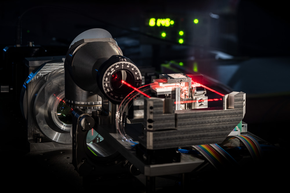 Laser-based addressing optics for an ion trap of a quantum computer.