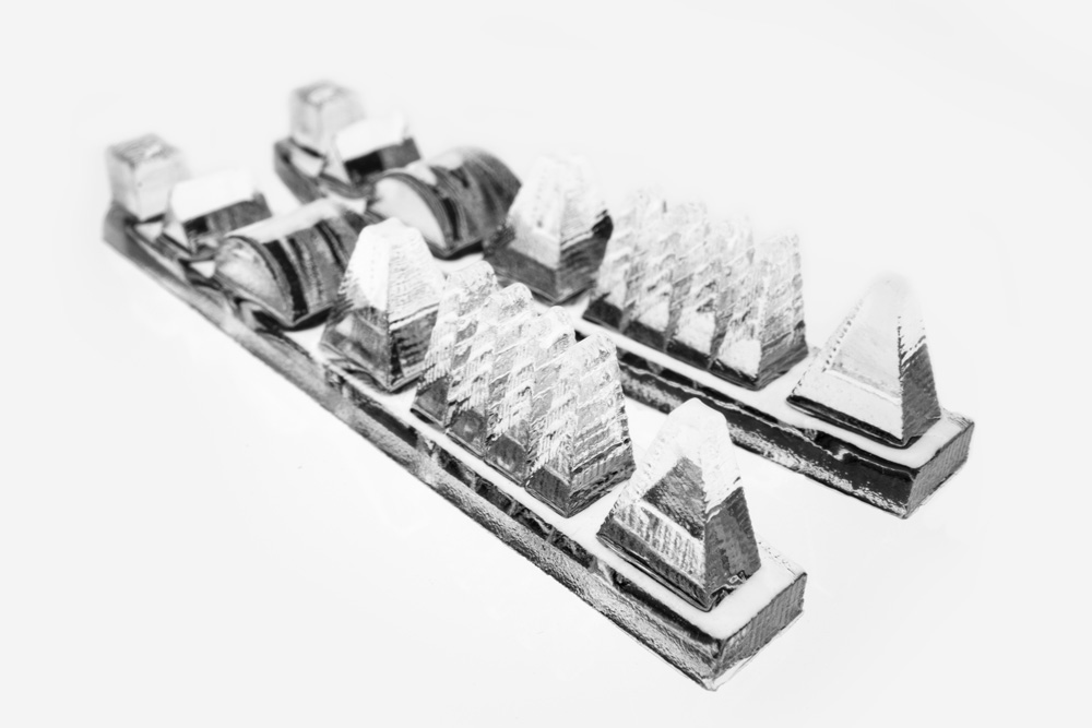 3D-printed free-form optics for light field shaping.