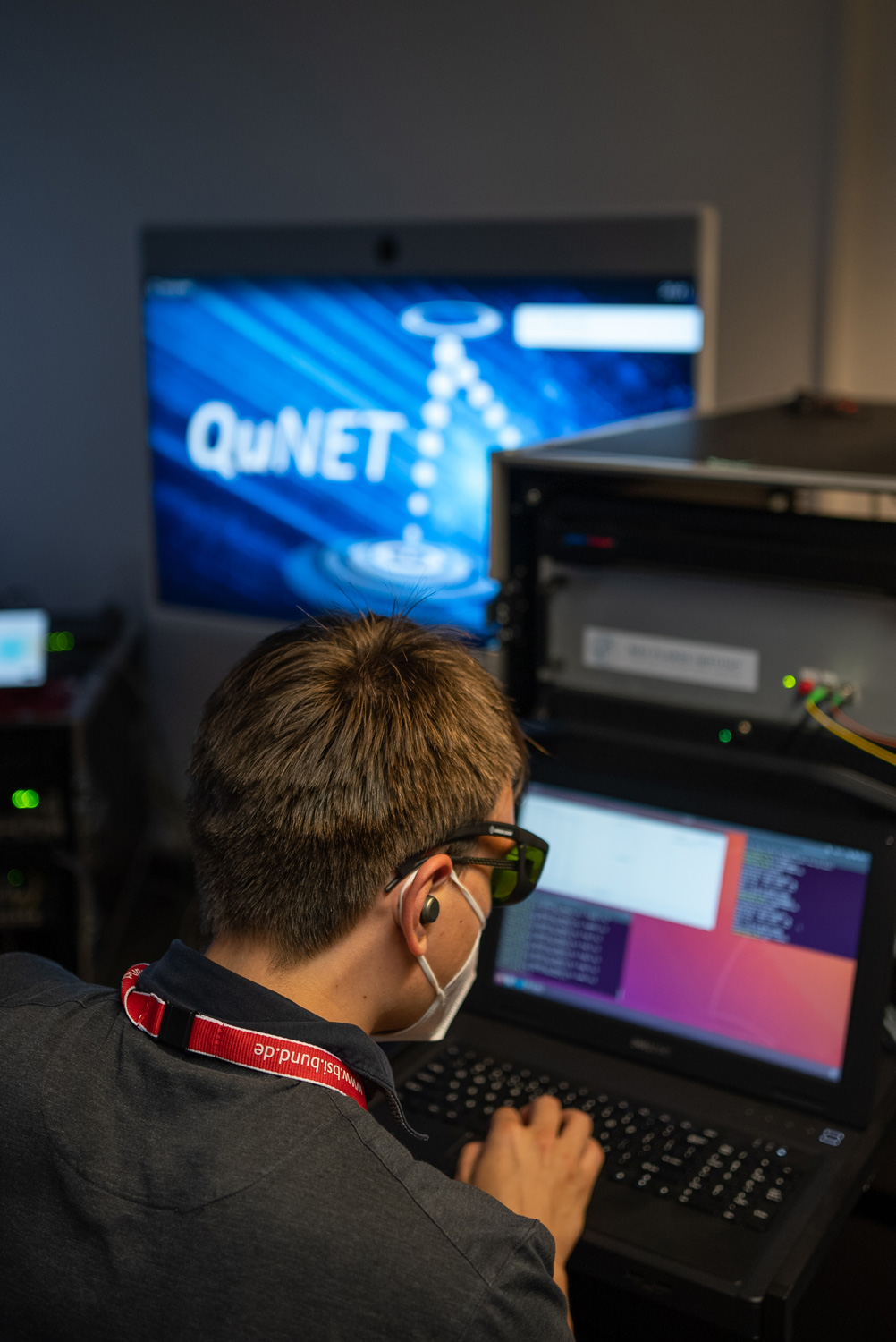 A scientist checks data on a laptop.