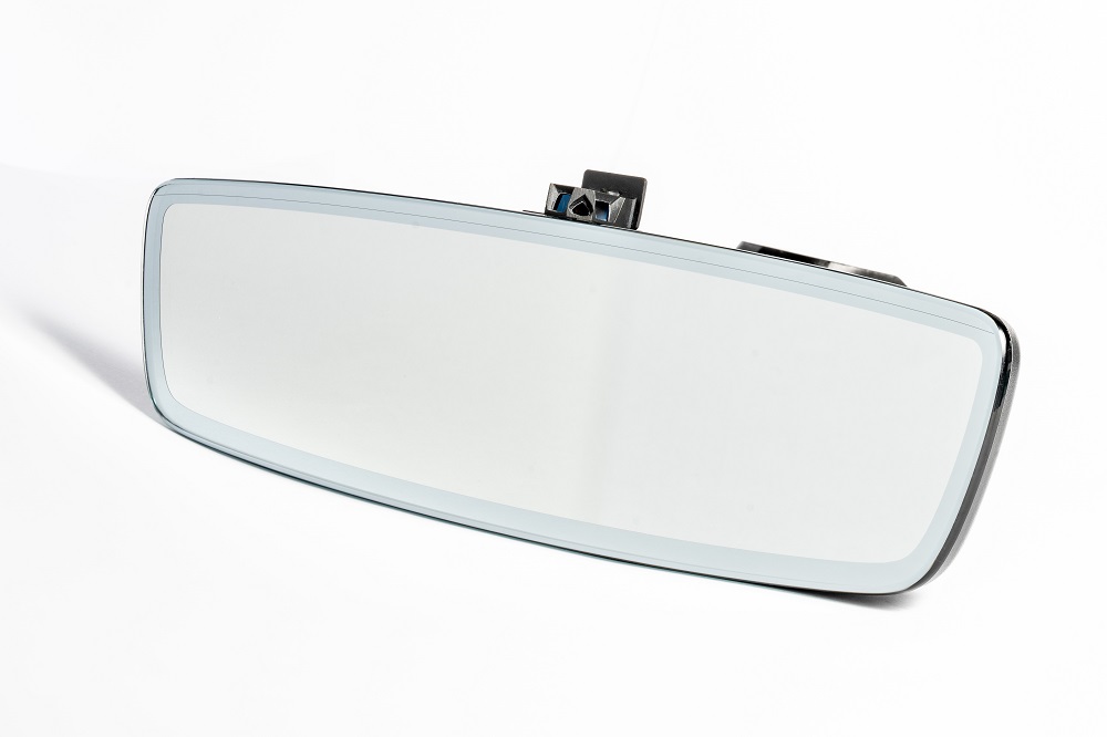 The miniaturized wide-angle 3D camera is mounted on the underside of the rearview mirror. 