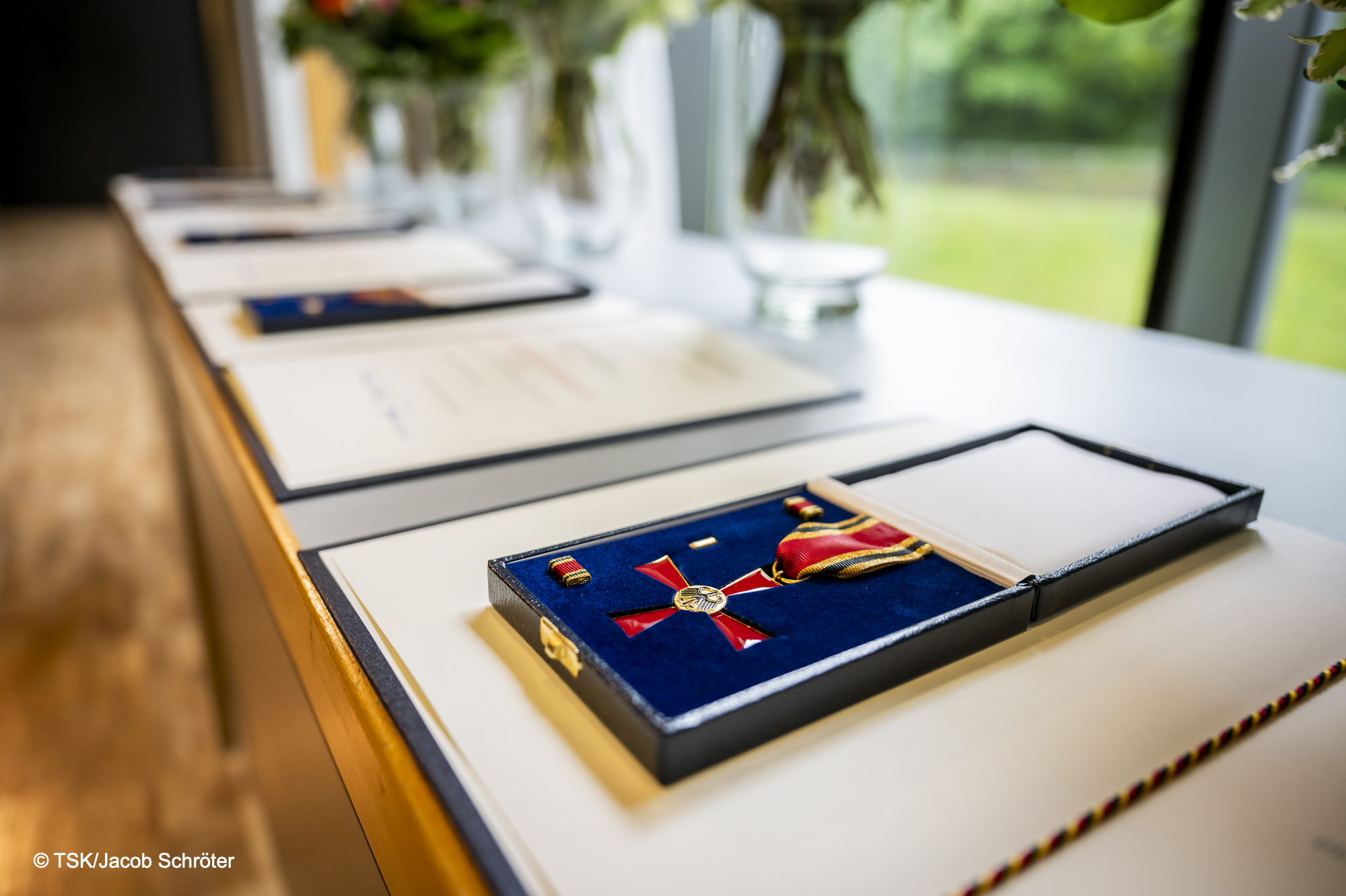 Close-up of the Order of Merit, lying in a casket on a table.